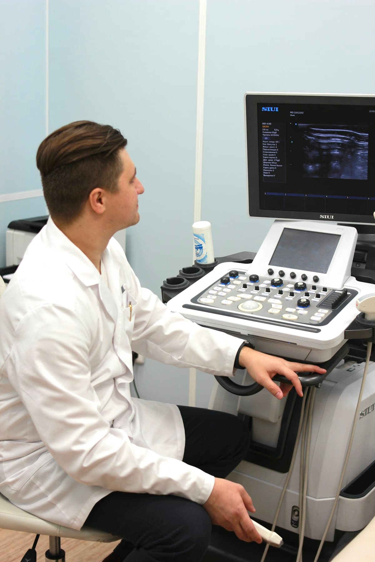 A clinician at an ultrasound machine